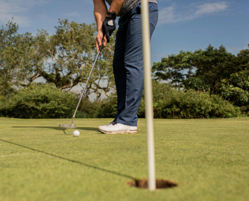 Private golf lessons session focusing on putting technique and alignment