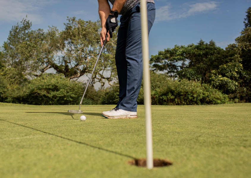 Private golf lessons session focusing on putting technique and alignment