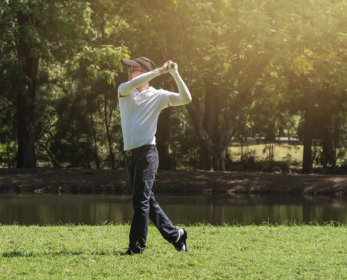 Golfer doing golf swing speed training drill after a lesson