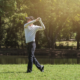 Golfer doing golf swing speed training drill after a lesson