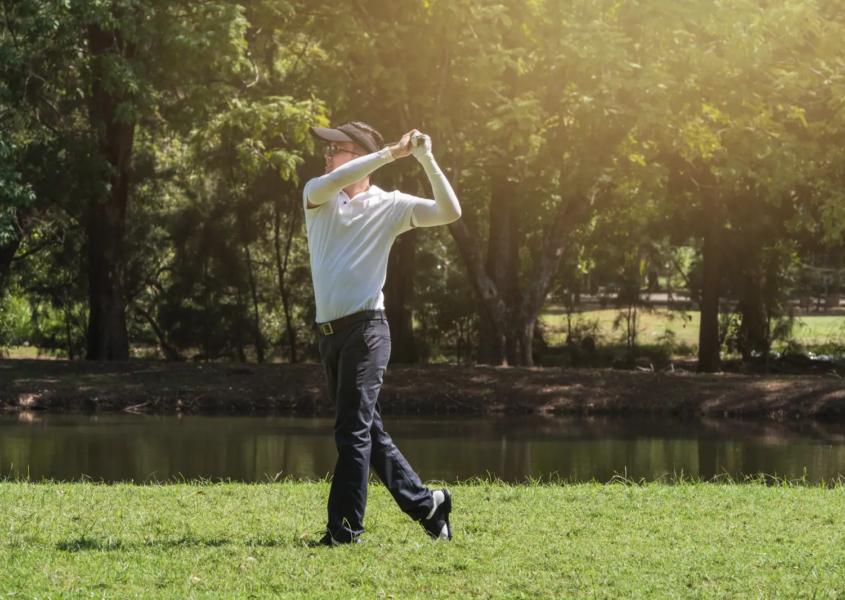 Golfer doing golf swing speed training drill after a lesson