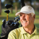Seasoned player practicing after golf lessons for experienced golfers