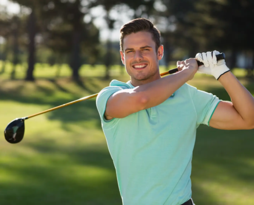 Smiling beginner after first golf lessons for beginners session in Austin