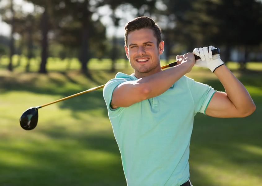Smiling beginner after first golf lessons for beginners session in Austin