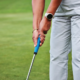 Close-up of golf grip adjustment by a PGA certified instructor