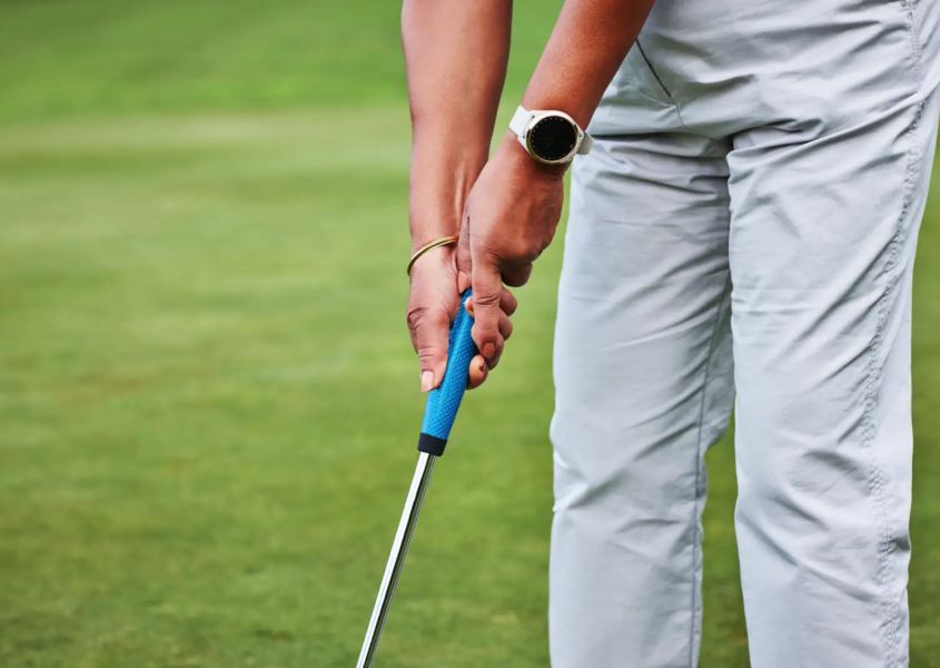 Close-up of golf grip adjustment by a PGA certified instructor