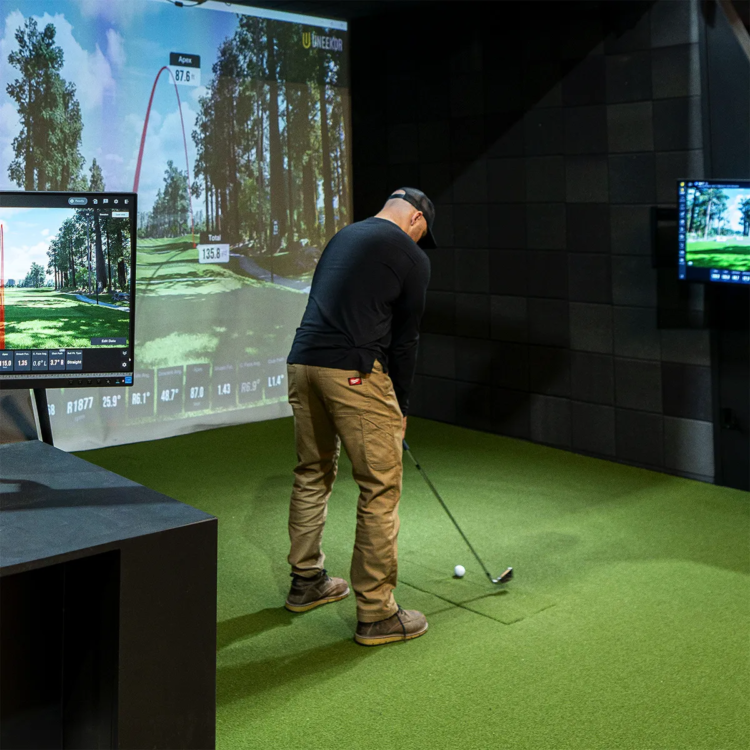 Man using golf simulator at a lesson in Austin