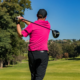 Golfer practicing as part of consistent golf training schedule