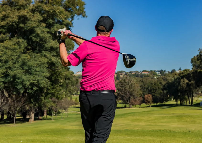 Golfer practicing as part of consistent golf training schedule