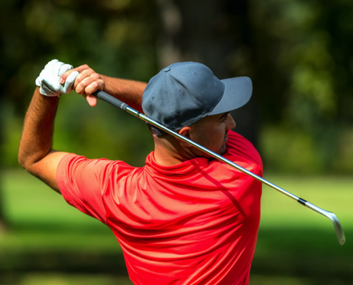 PGA pro demonstrating proper grip and setup during golf swing analysis session