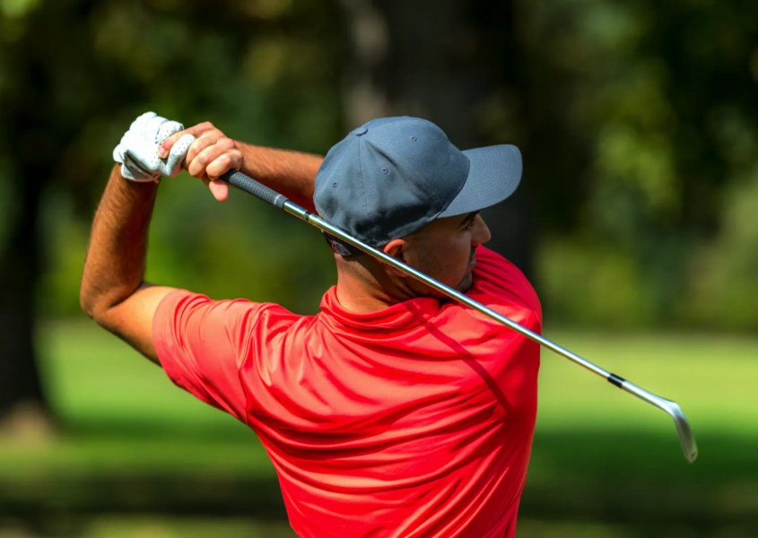 PGA pro demonstrating proper grip and setup during golf swing analysis session